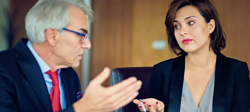 Man and women frustrated in meeting