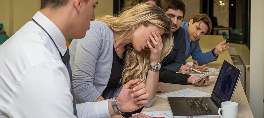 Unhappy woman in meeting