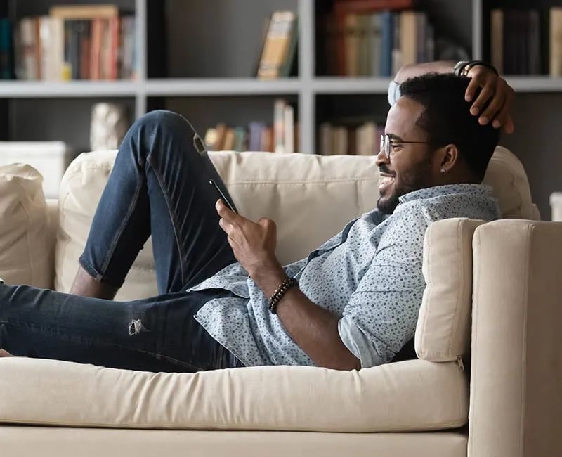 A man reacts to a message on this phone device